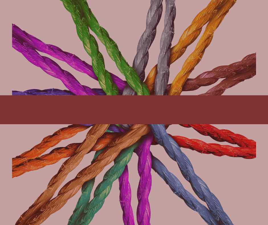 Colorful twisted ropes intertwined against a muted background. Colorful twisted ropes intertwined against a muted background.